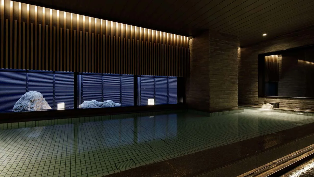 チャプター京都 トリビュートポートフォリオホテルの静寂な大浴場。石と光のアートのような空間で、心身ともに解き放たれる至福のリラックスタイム。